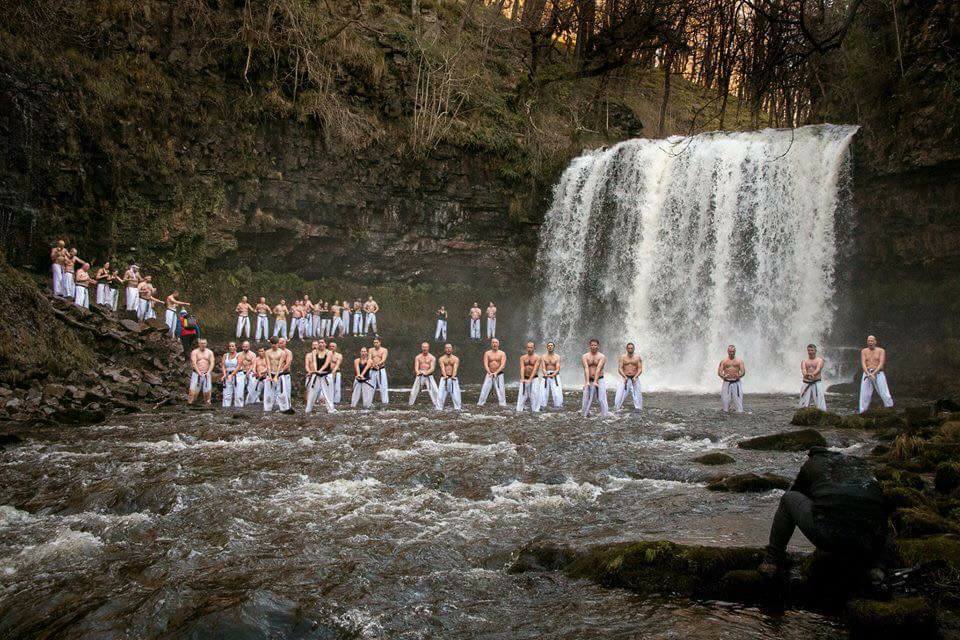 martial artists take welsh waterfall
